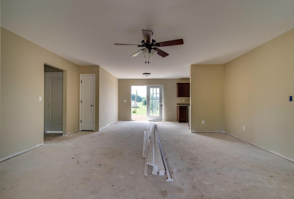 590 Murrell Road Dickson, TN 37055 - Photo 3 of 25 a view of a livingroom with a window and a ceiling fan