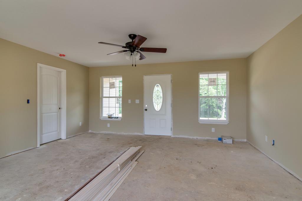 590 Murrell Road Dickson, TN 37055 - Photo 10 of 25 a view of a livingroom with a chandelier fan and windows