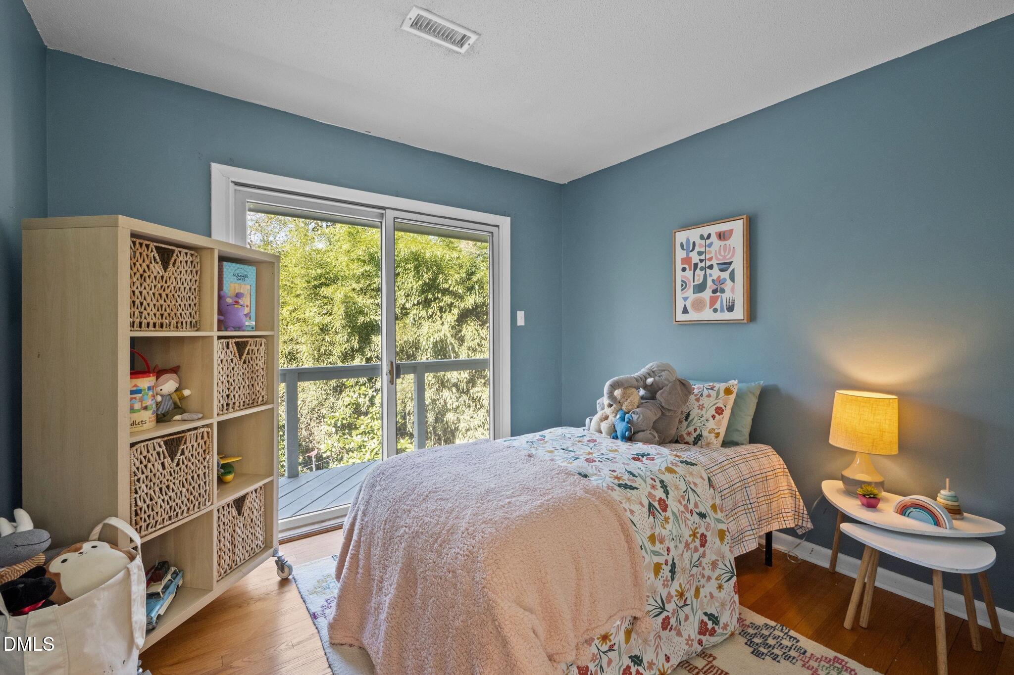 1709 Curtis Road Chapel Hill, NC 27514 - Photo 37 of 62 a bedroom with a bed and a window