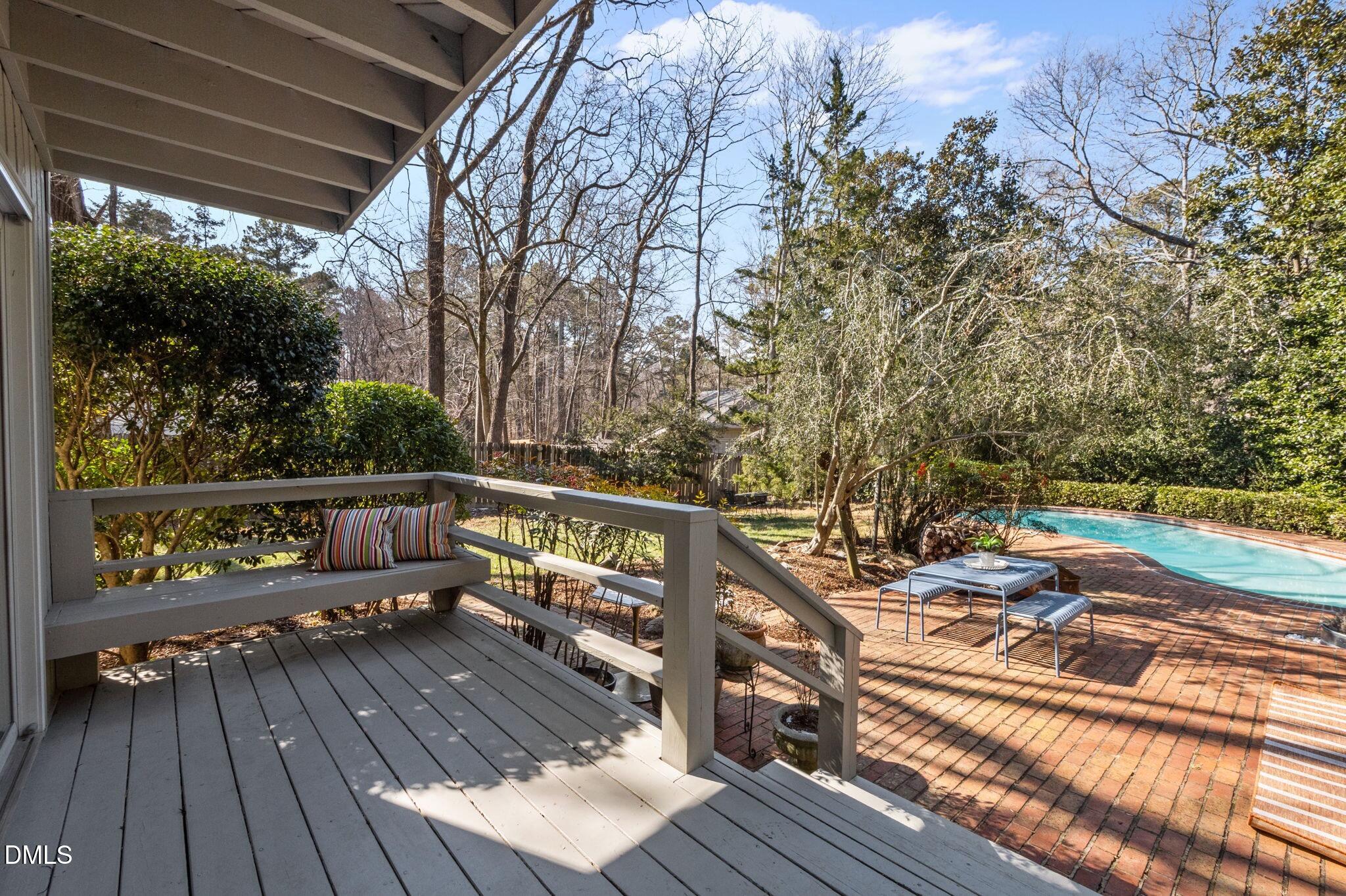 1709 Curtis Road Chapel Hill, NC 27514 - Photo 42 of 62 a view of a balcony with wooden floor and outdoor seating