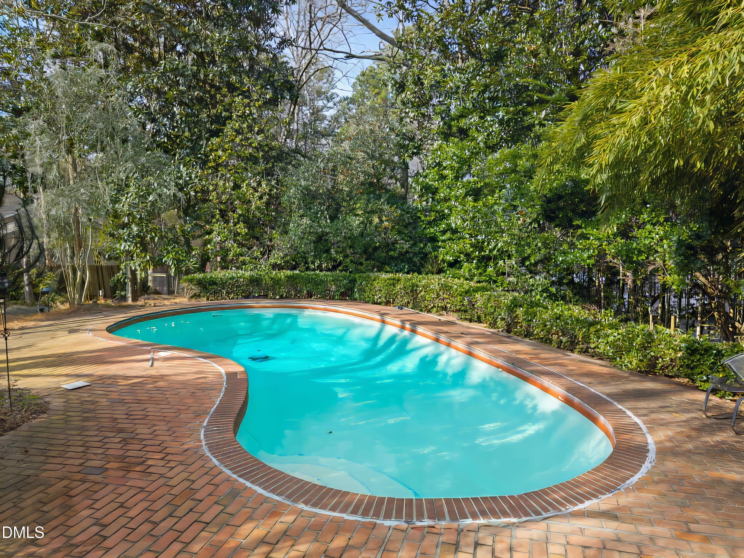 1709 Curtis Road Chapel Hill, NC 27514 - Photo 46 of 62 a view of a swimming pool with a yard