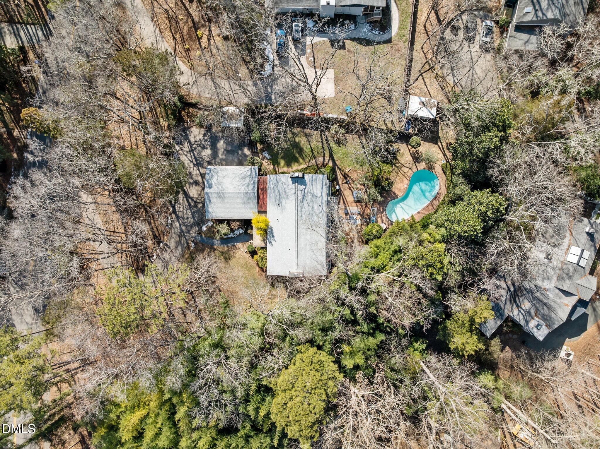 1709 Curtis Road Chapel Hill, NC 27514 - Photo 52 of 62 a aerial view of a house with a yard and garden
