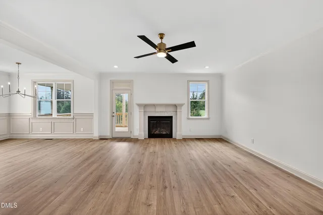 a large kitchen with kitchen island a sink stainless steel appliances and cabinets