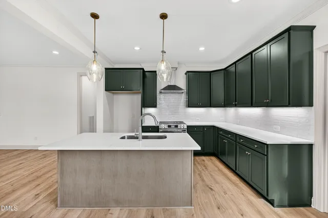 a spacious bathroom with a granite countertop sink a mirror and a shower