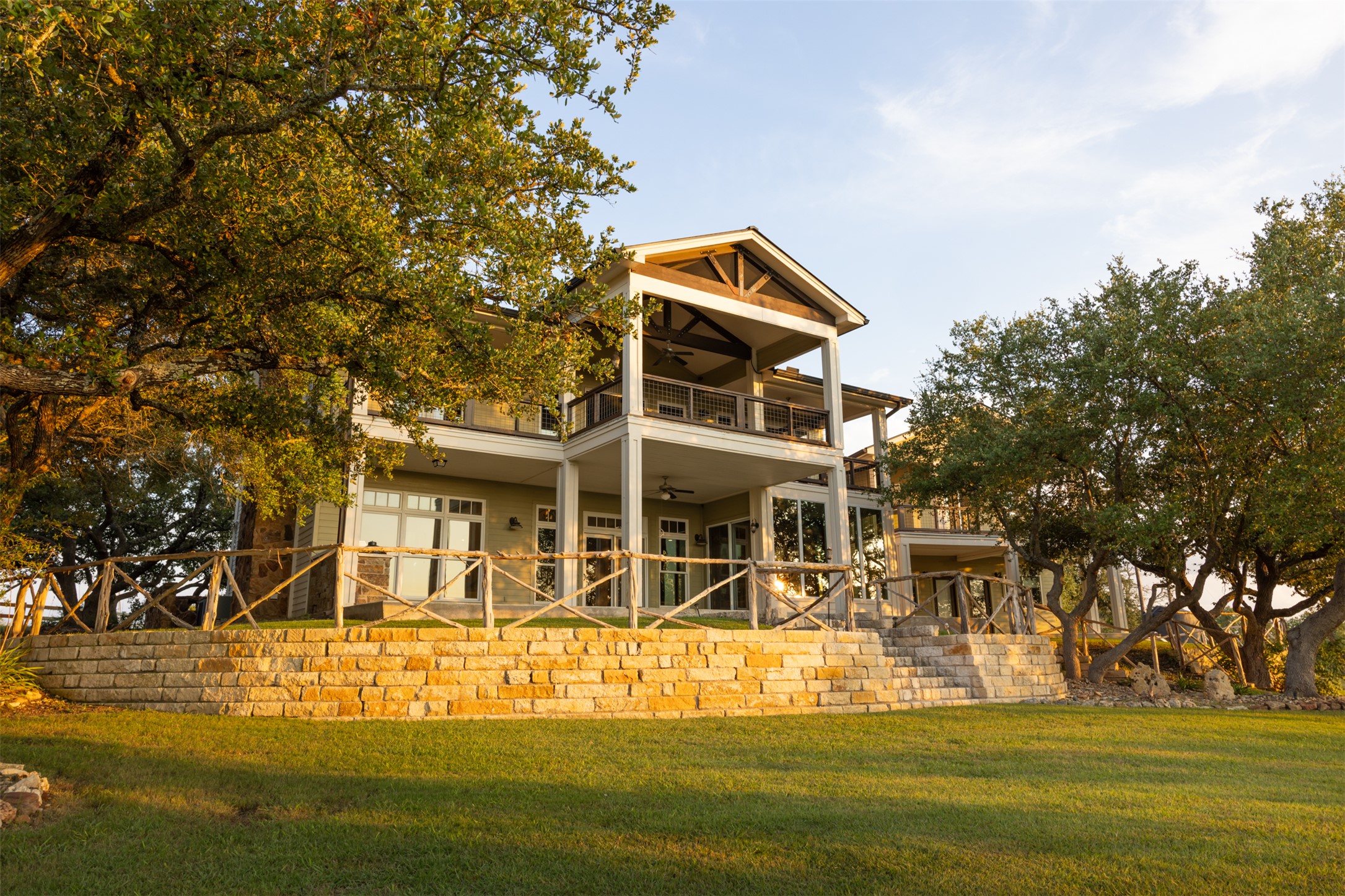 3149 Byrd Ranch Road Johnson City, TX 78636 - Photo 2 of 39 Rear view of house with a lawn, a patio, and ceiling fan