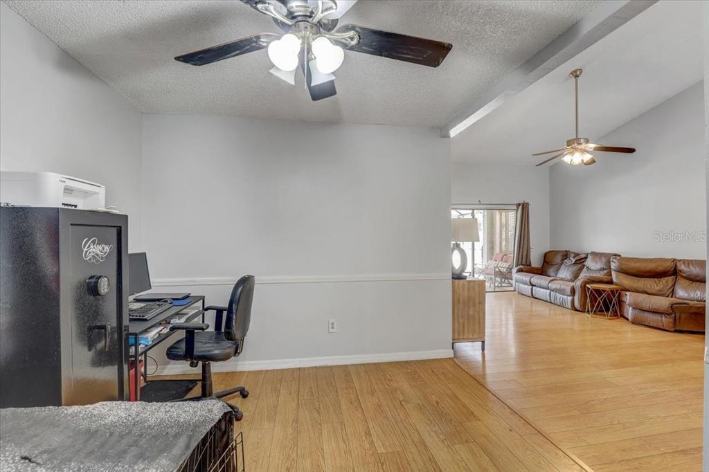 2524 Wrencrest Circle Valrico, FL 33596 - Photo 13 of 36 a view of a livingroom with furniture and a ceiling fan