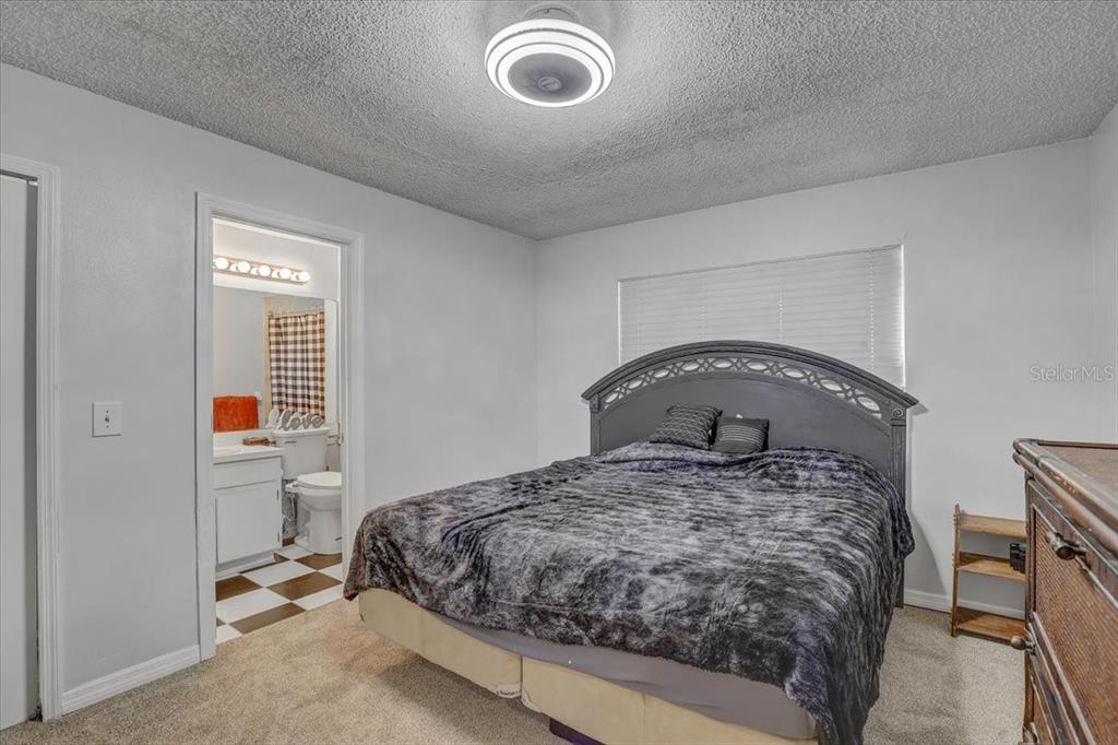 2524 Wrencrest Circle Valrico, FL 33596 - Photo 14 of 36 a bedroom with a bed and a window