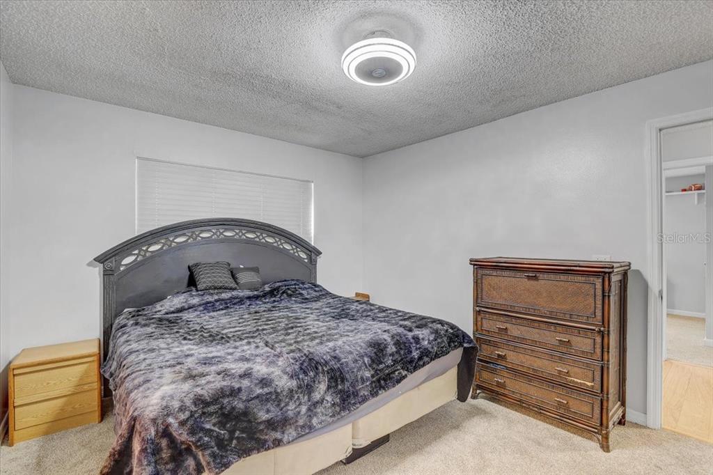 2524 Wrencrest Circle Valrico, FL 33596 - Photo 15 of 36 a bedroom with a bed and a dresser