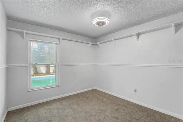 a view of room with furniture and closet