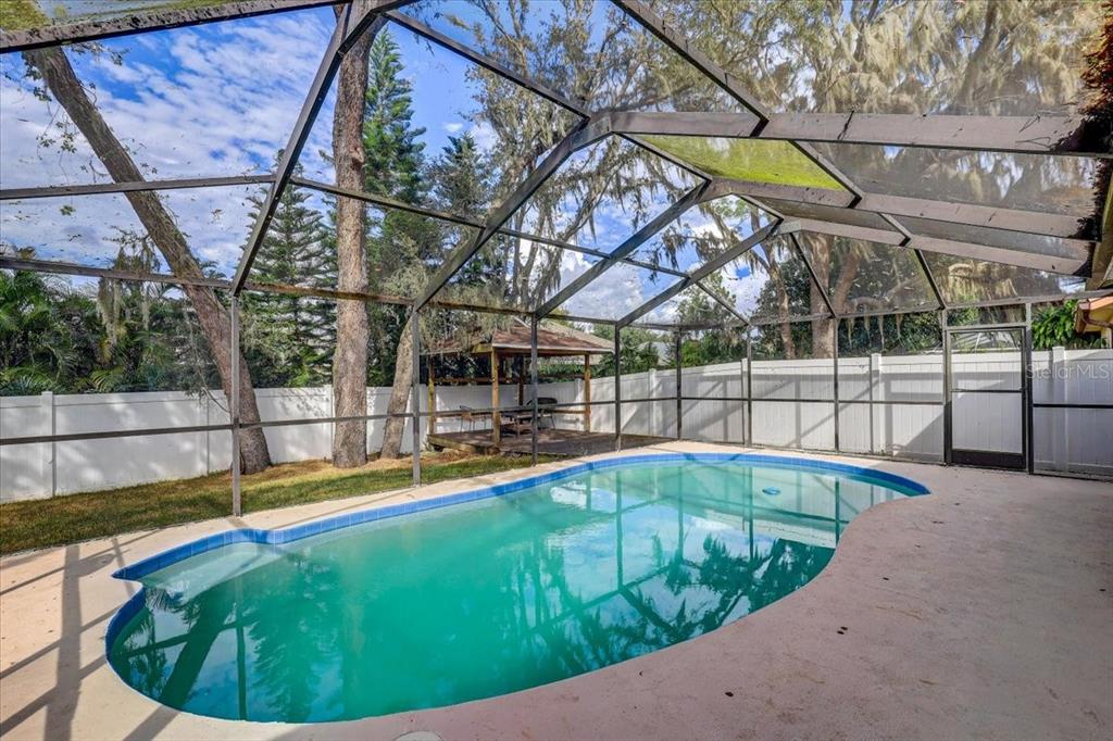 2524 Wrencrest Circle Valrico, FL 33596 - Photo 2 of 36 a view of a backyard with a swimming pool