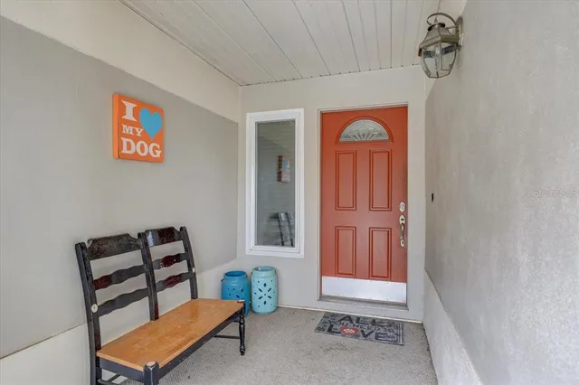 a view of room with window and lounge chair