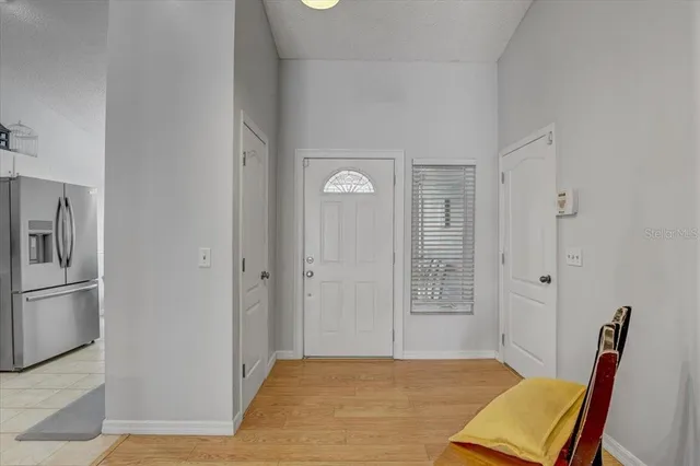 a view of room with furniture and wooden floor