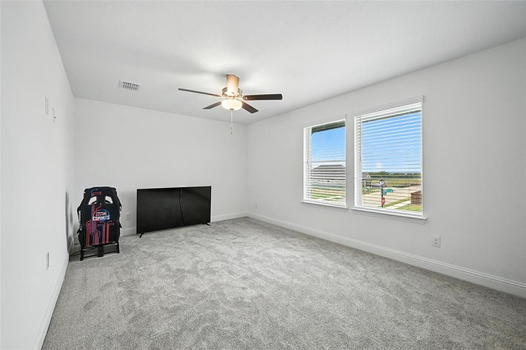 447 Holly Road Little Elm, TX 75068 - Photo 22 of 30 a view of an empty room with a window