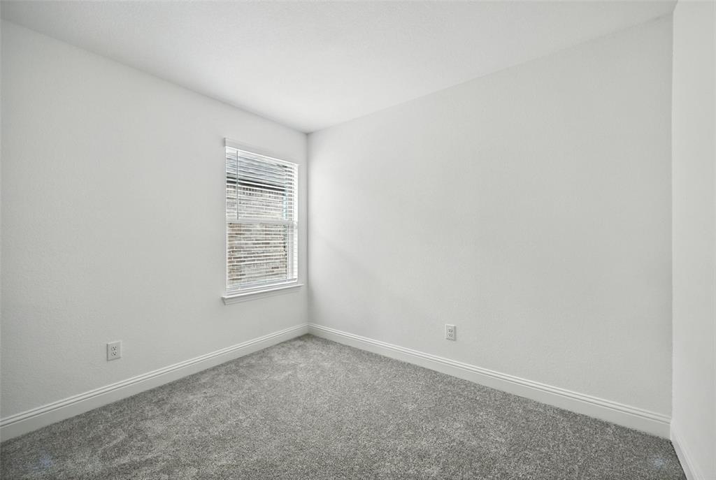447 Holly Road Little Elm, TX 75068 - Photo 26 of 30 an empty room with a window