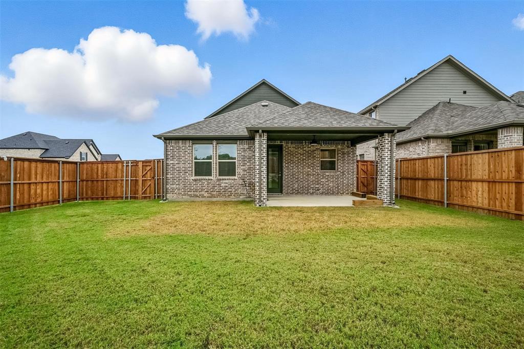 447 Holly Road Little Elm, TX 75068 - Photo 27 of 30 a view of a house with garden
