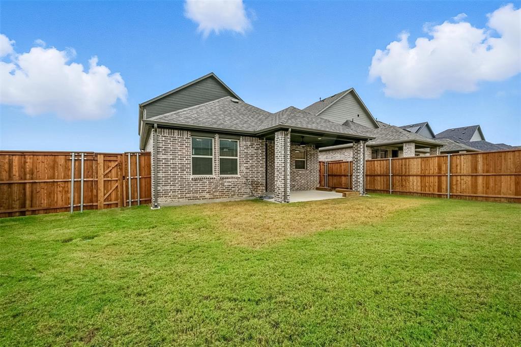 447 Holly Road Little Elm, TX 75068 - Photo 28 of 30 a view of a house with garden