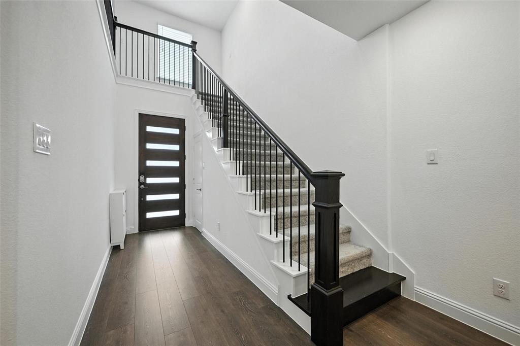 447 Holly Road Little Elm, TX 75068 - Photo 6 of 30 a view of a hallway with staircase