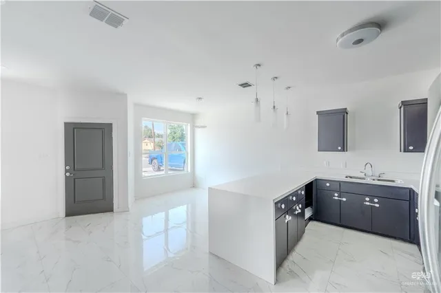 a spacious bathroom with a bathtub sink and mirror