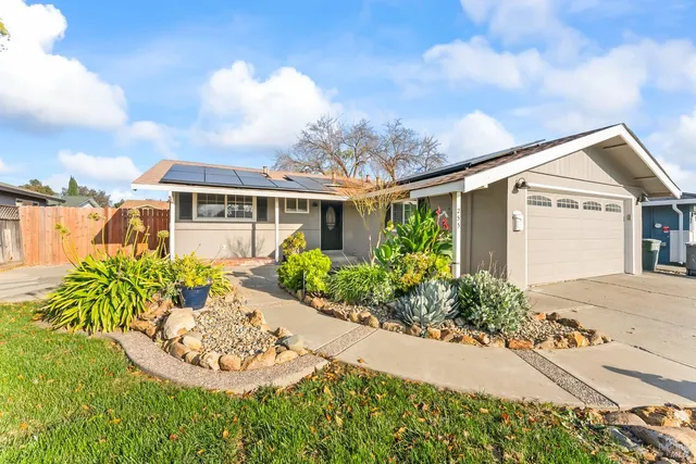 front view of a house with a yard