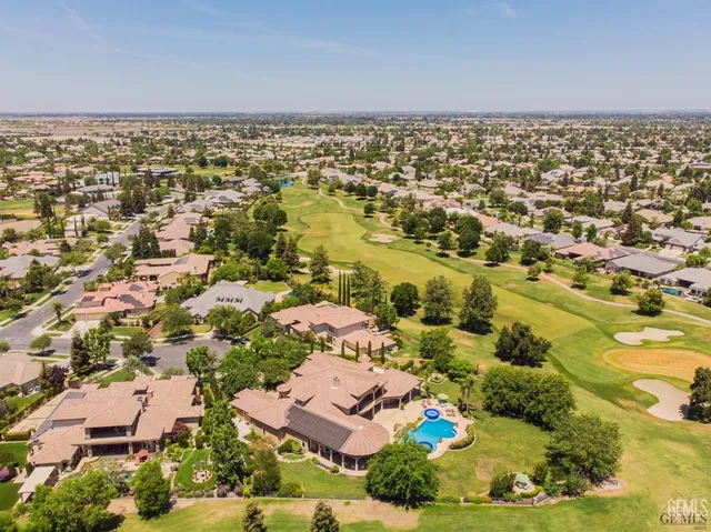 an aerial view of residential building with parking space