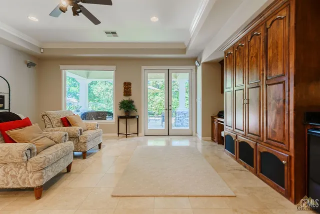 a bathroom with a granite countertop sink a toilet a mirror and shower