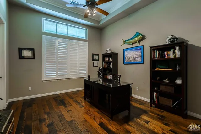 a room with pool table and windows
