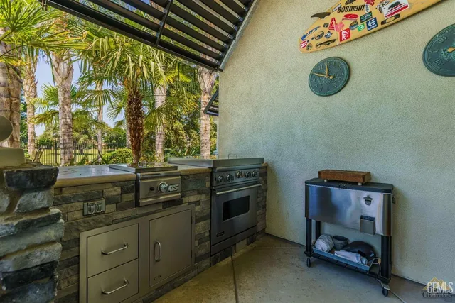an aerial view of a house with a yard and a mountain view in back