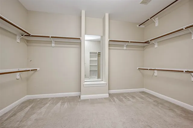a view of an empty walk in closet