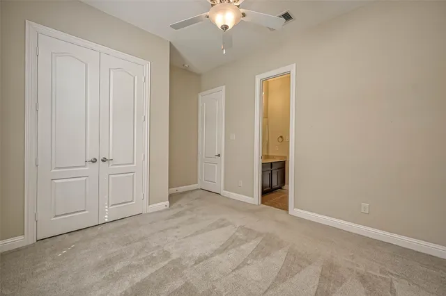 a view of an empty room with a chandelier