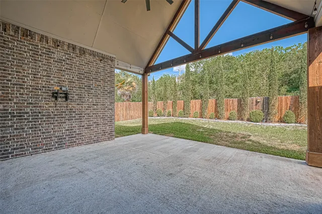 a view of backyard with green space
