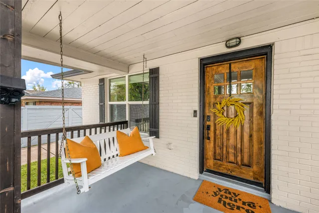 a view of a door and wooden floor