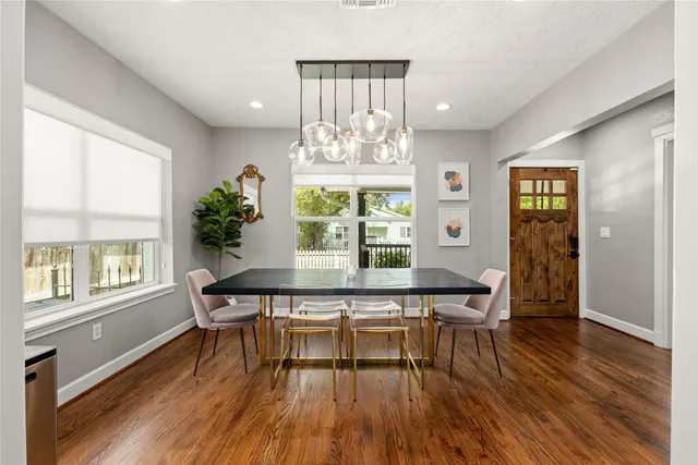 a view of a dining room with furniture window and wooden floor
