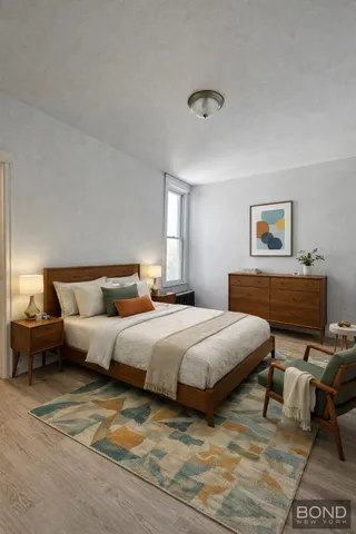 a spacious bedroom with a bed and window