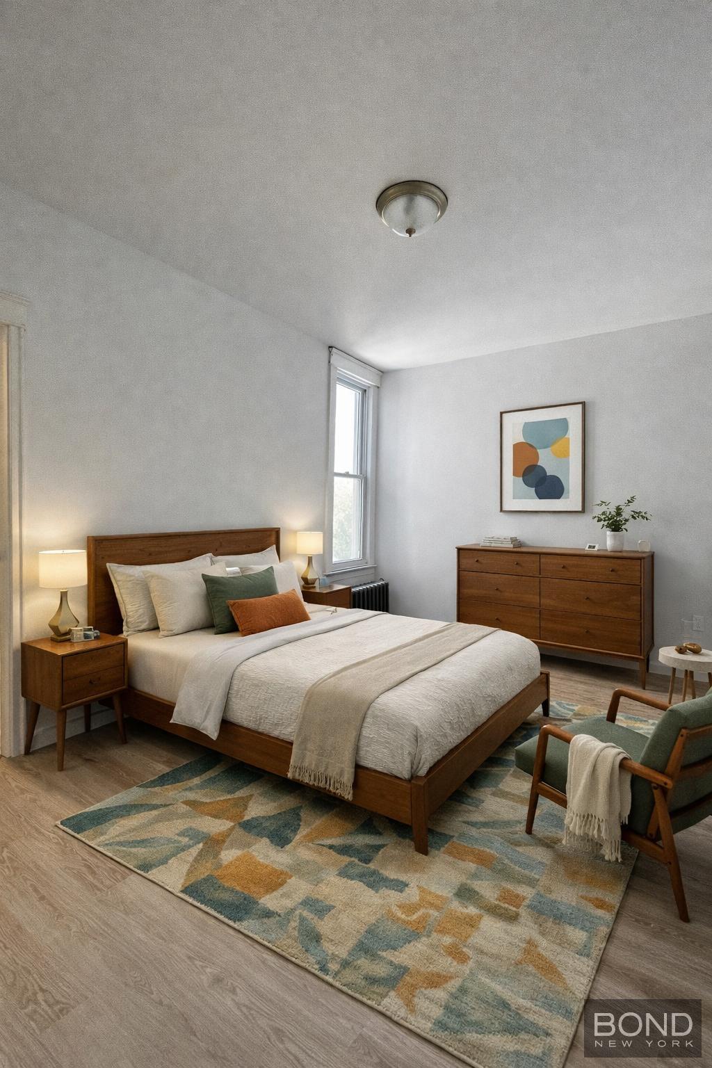 60-36 68th Road, Unit 2 Queens, NY 11385 - Photo 3 of 5 a spacious bedroom with a bed and window