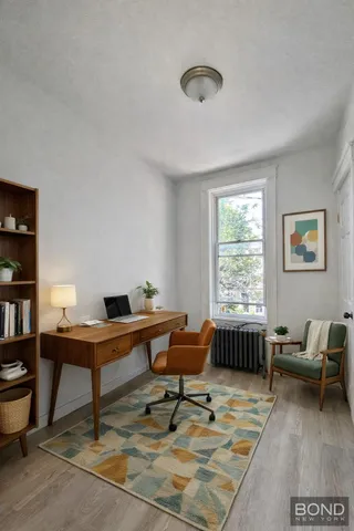 a workspace with furniture and a window