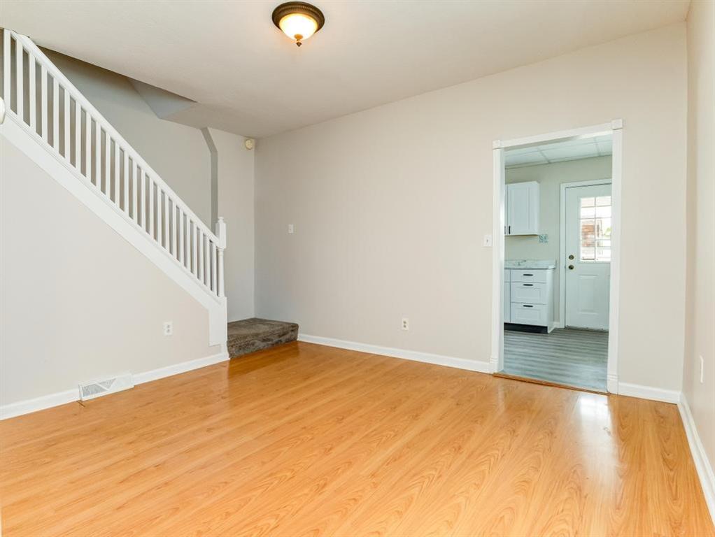 448 Park Street Rochester, PA 15074 - Photo 5 of 29 a view of an empty room with wooden floor