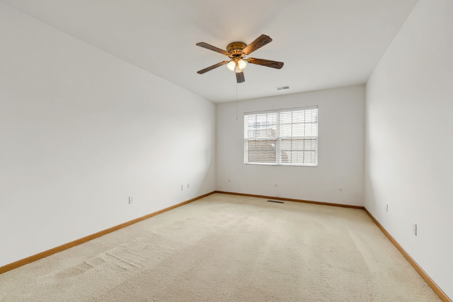 1397 Fox Hound Trail Beecher, IL 60401 - Photo 16 of 23 an empty room with windows and ceiling fan view