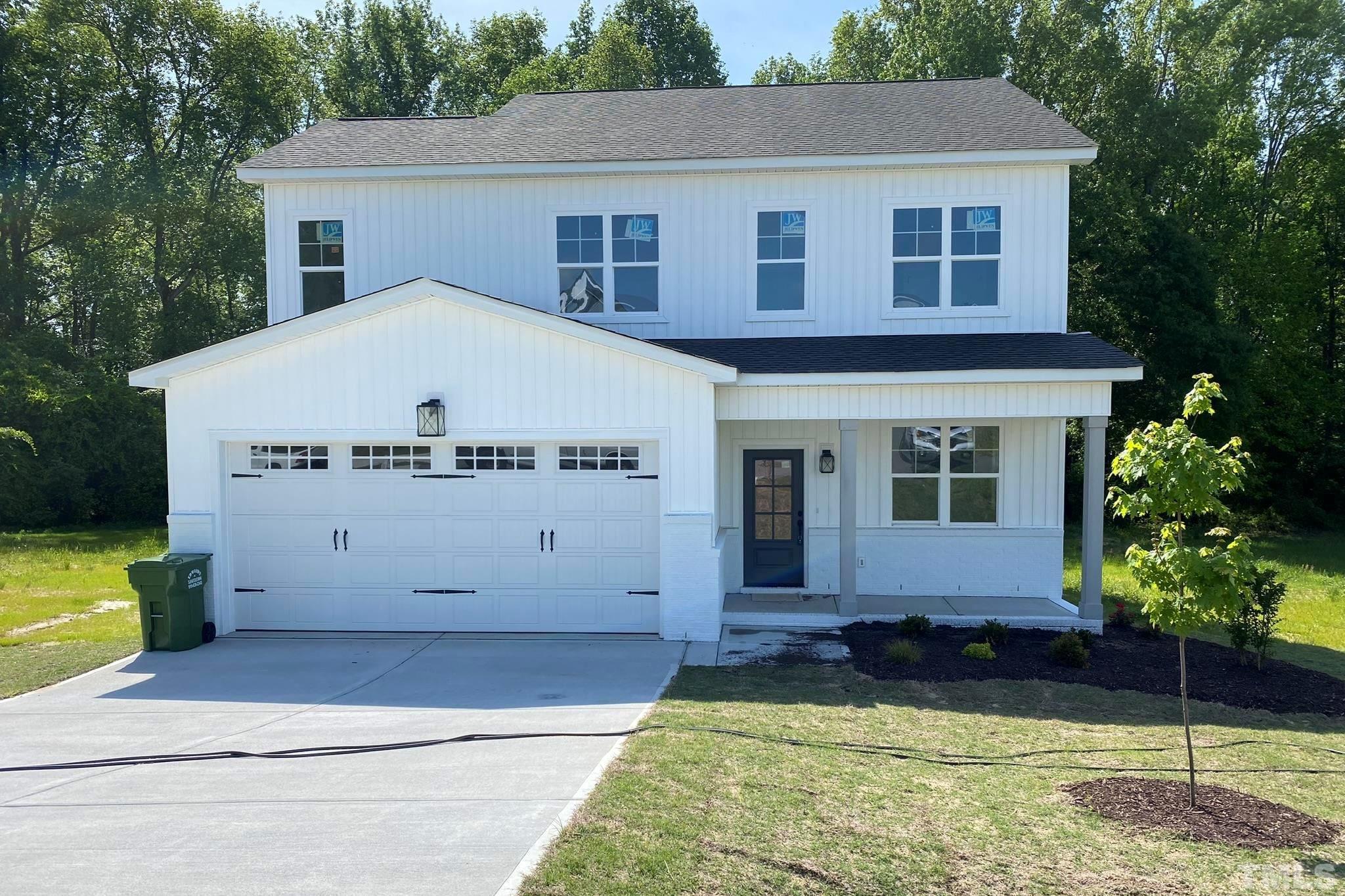 102 Buckstone Place Willow Spring, NC 27592 - Photo 1 of 25 a view of a house with a yard