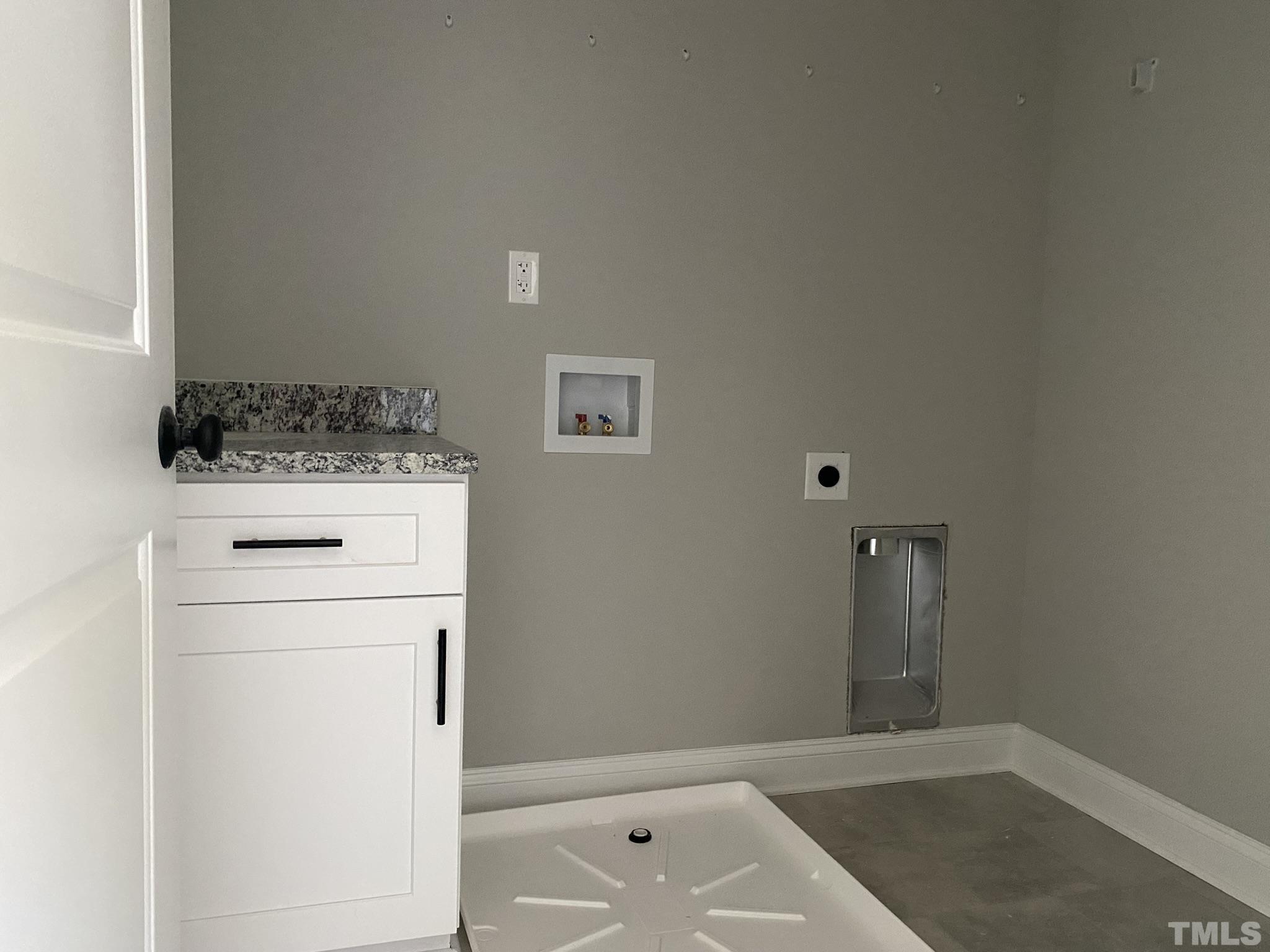 102 Buckstone Place Willow Spring, NC 27592 - Photo 12 of 25 a utility room with dryer and washer