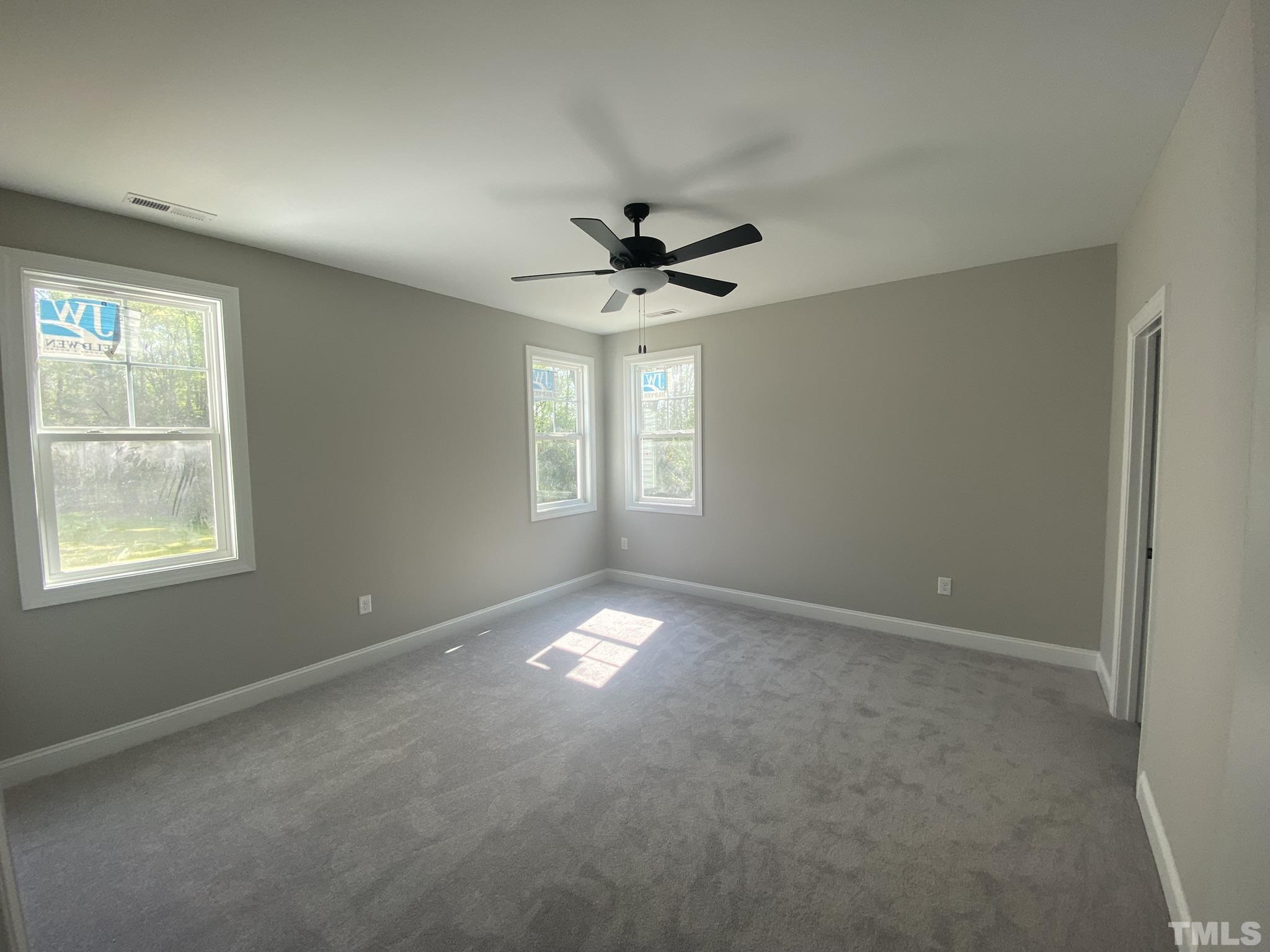 102 Buckstone Place Willow Spring, NC 27592 - Photo 13 of 25 a view of an empty room with a window