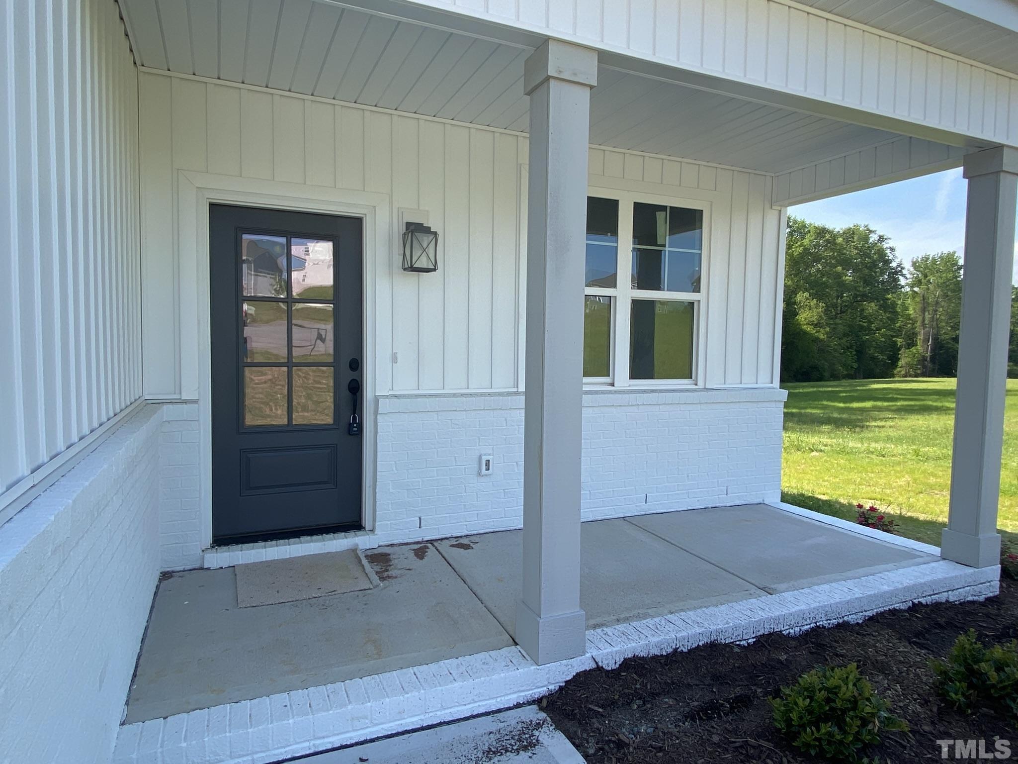 102 Buckstone Place Willow Spring, NC 27592 - Photo 2 of 25 a view of an empty room with a fireplace and a window