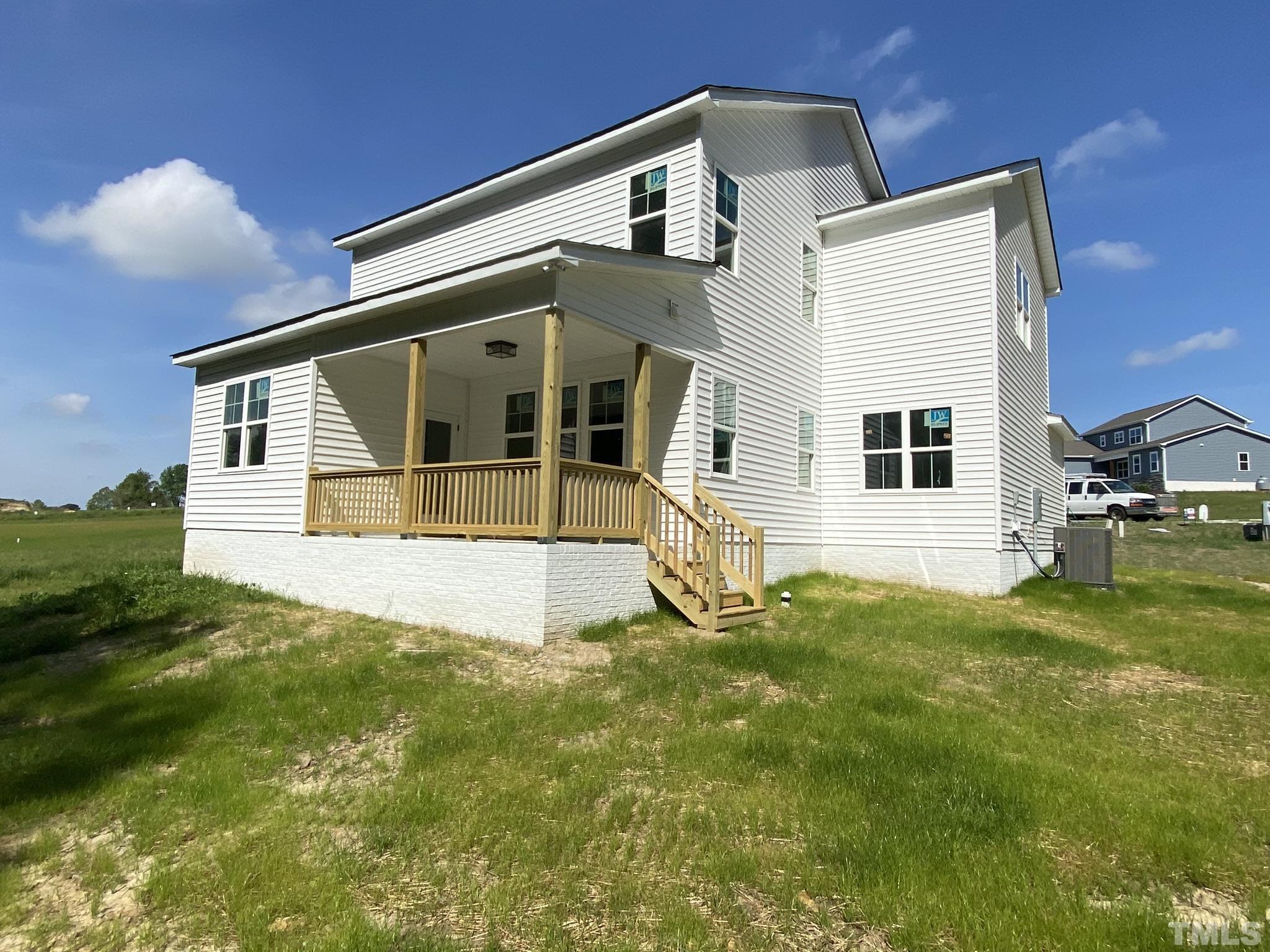 102 Buckstone Place Willow Spring, NC 27592 - Photo 23 of 25 a front view of a house with a yard