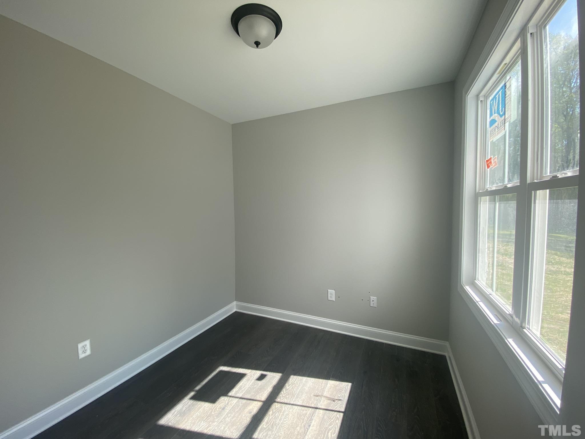 102 Buckstone Place Willow Spring, NC 27592 - Photo 9 of 25 an empty room with a window