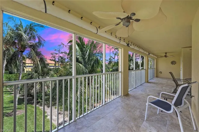 a view of a chairs and table in the balcony