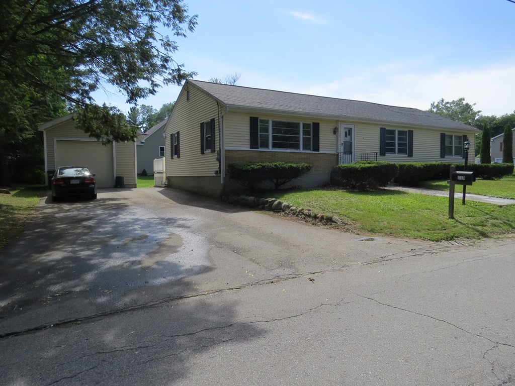 113 Old Ferry Road Haverhill, MA 01830 - Photo 1 of 22 a view of a house with a yard and large trees