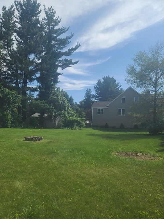 113 Old Ferry Road Haverhill, MA 01830 - Photo 20 of 22 a view of a field of grass and trees