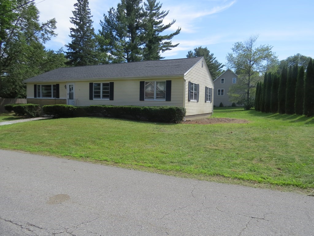 113 Old Ferry Road Haverhill, MA 01830 - Photo 2 of 22 a front view of a house with yard and green space