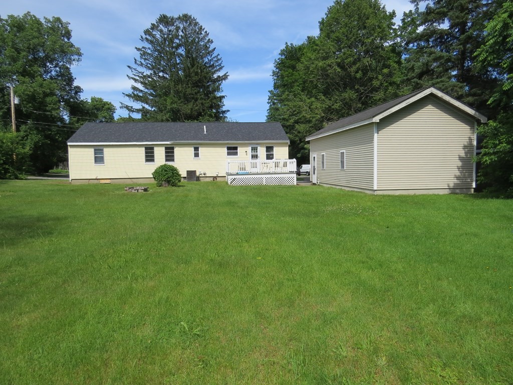 113 Old Ferry Road Haverhill, MA 01830 - Photo 3 of 22 a view of a house with a big yard potted plants and large tree