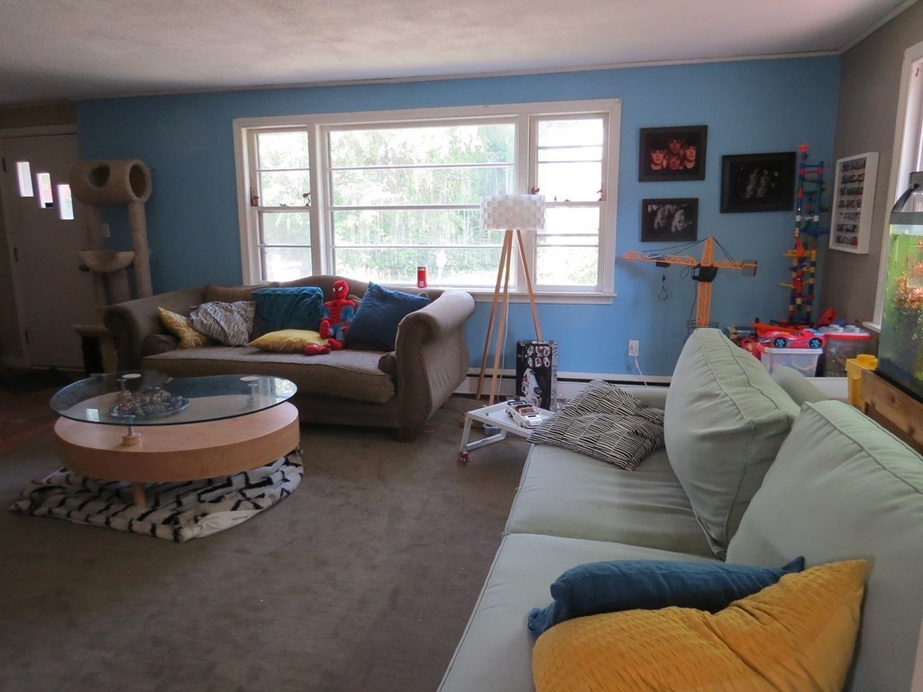113 Old Ferry Road Haverhill, MA 01830 - Photo 8 of 22 a living room with furniture and a large window