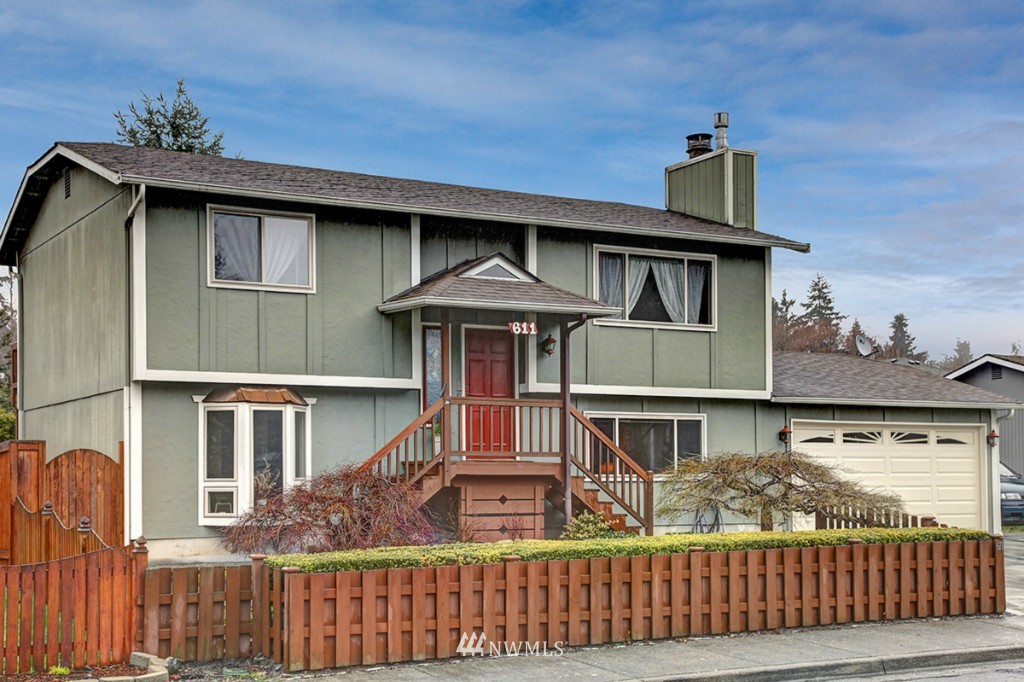 611 204th Street Southeast Bothell, WA 98012 - Photo 1 of 24 a front view of a house with a balcony